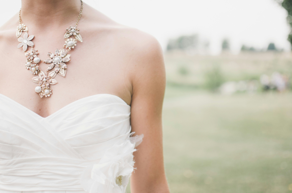 A collection of statement jewelry including bold necklaces, oversized earrings, and chunky bracelets, styled with elegant outfits to showcase confidence and boldness.