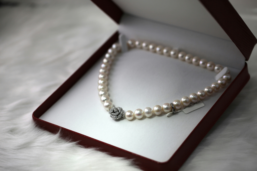 A collection of elegant pearl jewelry including necklaces, earrings, and bracelets, styled for different occasions from casual to formal.